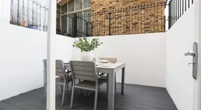 2BR Designer Apartment with Patio & Dining Space - Image 5