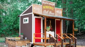 Cozy Wild West Covered Wagon next to River - Image 5