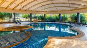 StayVista's Emerald Acres offering a heated pool, bonfire, snooker table, scenic views, tennis court, steam room, gazebo, & gym - Image 4