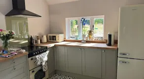 A charming cottage nestled in a peaceful woodland - Image 3