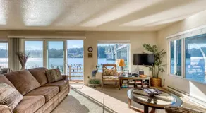 Incredible Riverfront Oasis with Wraparound Deck & Cozy Interior - Image 2