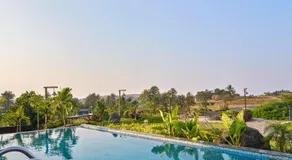 SaffronStays Ashfield - 5BHK Eco-Farmhouse with Pools, Jacuzzi, Lawn & Games Room - Image 4