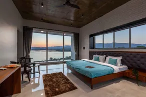 StayVista's Bellisimo Panorama - Lakeside Oasis with Infinity Pool, Modern Interiors, Open-to-Sky Bathtub, and Lush Green Lawn - Image 2