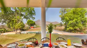 SaffronStays Deckhouse 47 - 3BR pet-friendly industrial-style pool villa with bonfire, BBQ, rain dance & celebration turf - Image 4