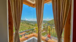 Central Homestay Ooty by VOYE HOMES Family-Friendly Budget Stay with Valley And Mountain Views - Image 4