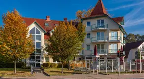 Ferienwohnung Möwe mit Balkon und einem Strandkorb im Sommer - Image 5