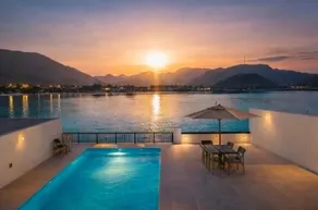 Azure Escape - Swimming Pool with Sea and Mountain view - Al Dana Island Fujairah - Image 3
