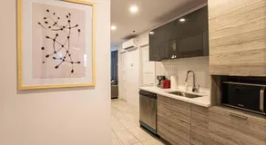 Modern 2BR Retreat with Parking & Gym Near Downtown & Airport - Image 5