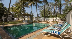 StayVista's Casa Blanca - Modern elegance with a pool, spacious lawn & diverse activities - Image 2