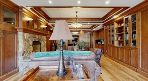 ski-in - ski-out condo with a deck ski views & a shared pool and hot tub - Image 4