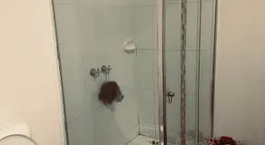 Guest room with private bathroom and living space - Image 2
