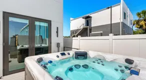 Salty Serenity Villa - New Luxe Escape with Hot Tub Spa & Rocket Views - Walk to Beach - Image 2