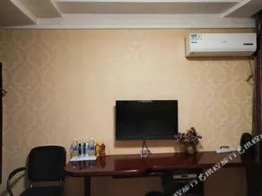Linjiang Guanglong Business Hotel - Image 4