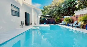 Stay Central: Relax in Our Heated Pool Oasis - Image 2