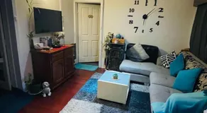 Guest room with private bathroom and living space - Image 1