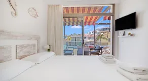 Cozy 2BR Retreat With Big Terrace, Peaceful Stay Minutes Away From the Beach - Image 2