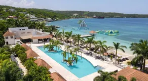 Sunset at ArecaHomes Beach Access Pool and Water Park - Image 3