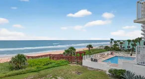 Direct oceanfront 2/2 corner condo with large balcony, heated pool, and garage parking - Image 4