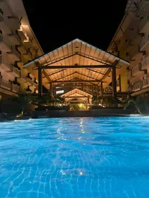 Amani Grand Resort Residences by JC SpaceRentals balcony pool view, Ground floor, 5mins from airport, free WIFI, NETFLIX - Image 3