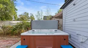 City Lights Soaking Nights Hot Tub Near Arena - Image 4