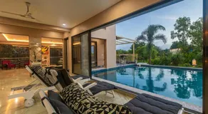 SaffronStays Aura - 4BR luxury pool villa with gym, BBQ deck, lawns & indoor games near Kihim Beach - Image 2