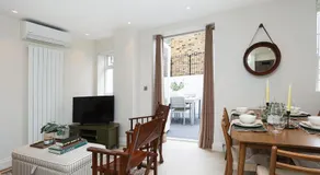 2BR Designer Apartment with Patio & Dining Space - Image 3