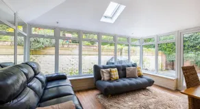 En-suite with double bed on mezzanine and desk in family home - Image 3