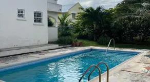 Oistins 2BR Condo with Pool & Patio, Walk to Miami Beach - Image 4