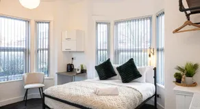 Private ensuite rooms with kitchen access by Irwell Stays - Image 2