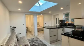 CozyNest 2BR Modern Property with Parking - Image 3