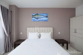 Comfort and Homey 2BR at Sentul Tower By Travelio - Image 2
