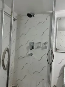 Rumi HomeStays-103-1 BHK Premium Furnished Room with Modern Bathroom, Kitchen and Dining - Image 5