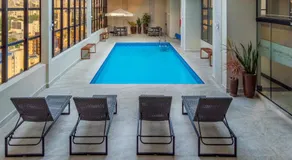 Apto Batel dentro do Hotel com Vaga e Piscina - Image 3