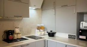 Chic Cozy Room with PS5, Mini Bar & Shared Spaces - Image 4
