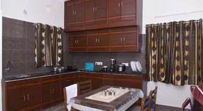 Four Seasons Homestay - Best Homestay in Tirupati- Luxurious Two Bedrooms Luxury AC apartments - Fast WiFi, Kitchen, Android TV - Easy access to Airport, Railway Station and to all Temples - Image 2