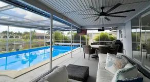 Waterfront 3BR Pool Oasis with Dock, Grill & Lounge - Image 4