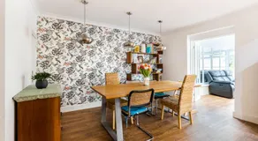 En-suite with double bed on mezzanine and desk in family home - Image 4