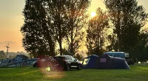 Natura Park Jurmala campsite with tent sites near a river - Image 4