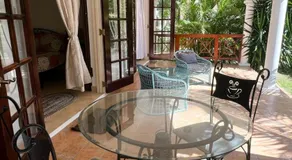 Oistins 2BR Condo with Pool & Patio, Walk to Miami Beach - Image 3
