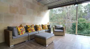 Coastal family retreat sun-drenched outdoor patio - Image 3