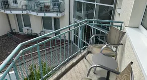 Ferienwohnung Möwe mit Balkon und einem Strandkorb im Sommer - Image 4