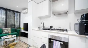 Luxury 2 Bedroom High Rise CBD Apartment with Gym and Pool - Image 4