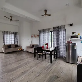 Spanish-inspired 2 BHK White Villa - Brinla Homes - Image 2