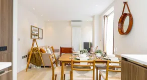 2BR Designer Apartment with Patio & Dining Space - Image 3
