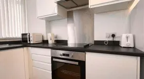 Stylish 3BR Stay with Garden & Parking - Image 3