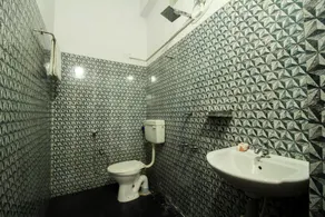SPOT ON 39897 Mukkam Tourist Home - Image 4