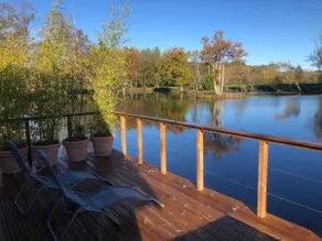 Chalet with a hot tub and terrace above the water - Image 4