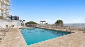 Direct oceanfront 2/2 corner condo with large balcony, heated pool, and garage parking - Image 3