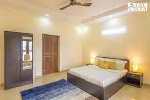StayVista at Olive fields with Shared pool, BBQ - Image 2