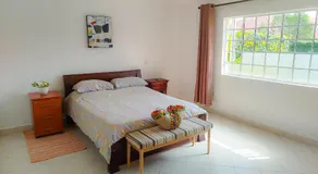 Urban Garden Hideaway Serene one-bedroom retreat with a private garden & chill veranda, 30 Minutes from JKIA - Image 2